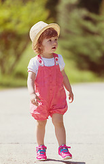 Image showing little girl runing in the summer Park