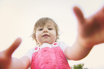 Image showing little girl spending time at backyard