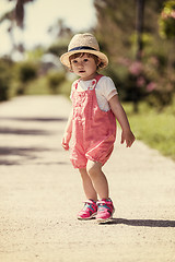 Image showing little girl runing in the summer Park