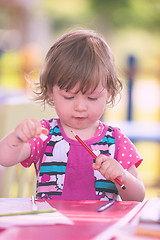 Image showing little girl drawing a colorful pictures