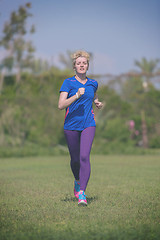 Image showing young female runner training for marathon