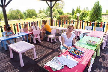 Image showing mom and little daughter drawing a colorful pictures