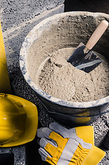 Image showing Tools for bricklayer bucket with a solution and a trowel, close-