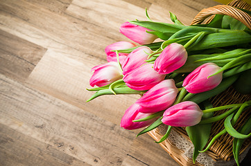 Image showing Beautiful bouquet from pink tulips  on a table