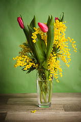 Image showing Spring bouquet with mimosa and tulips in a vase