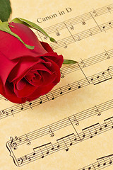 Image showing Red Rose Bud on Sheet Music