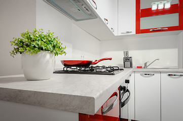 Image showing Modern red and white kitchen interior