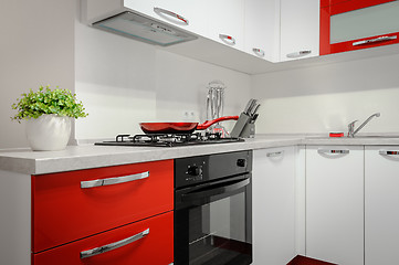 Image showing Modern red and white kitchen interior