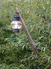 Image showing Old lantern hanging on a wooden pole