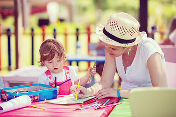 Image showing mom and little daughter drawing a colorful pictures