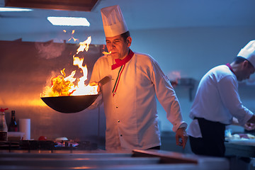 Image showing Chef doing flambe on food