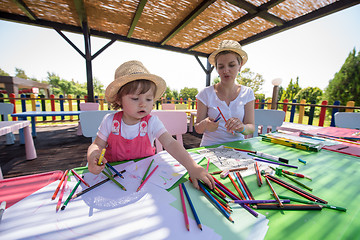 Image showing mom and little daughter drawing a colorful pictures