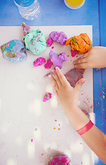 Image showing kid hands Playing with Colorful Clay