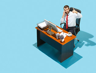 Image showing Shot from above of a stylish business man working on a laptop.