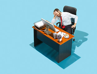 Image showing Shot from above of a stylish business man working on a laptop.
