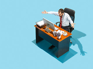 Image showing Shot from above of a stylish business man working on a laptop.