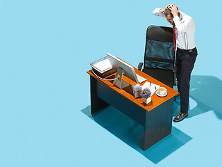 Image showing Shot from above of a stylish business man working on a laptop.