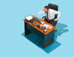 Image showing Shot from above of a stylish business man working on a laptop.