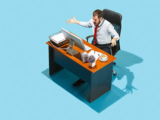 Image showing Shot from above of a stylish business man working on a laptop.