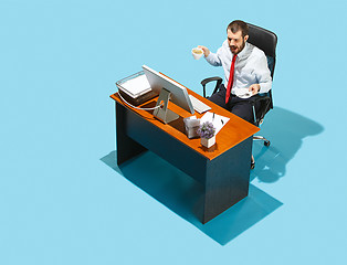 Image showing Shot from above of a stylish business man working on a laptop.