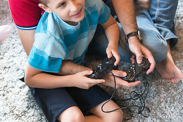 Image showing Happy family playing a video game