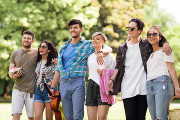 Image showing friends with guitar and picnic blanket at park