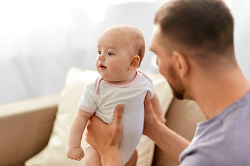Image showing father with little baby girl at home