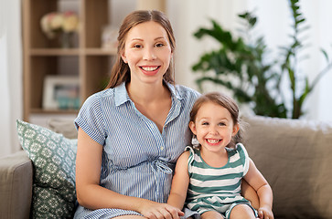 Image showing pregnant mother and daughter at home