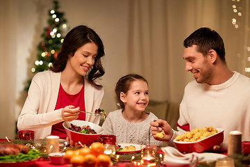 Image showing happy family having christmas dinner at home