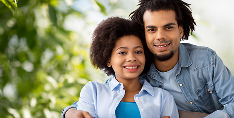 Image showing happy african american couple hugging