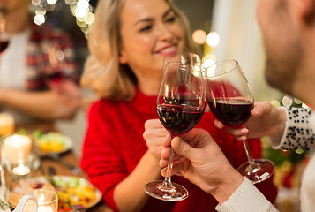 Image showing close up of friends with wine celebrate christmas