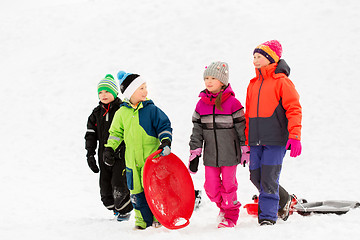 Image showing happy little kids with sleds in winter