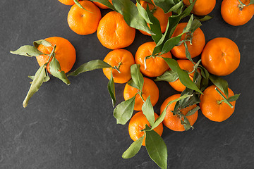 Image showing close up of mandarins on slate table top