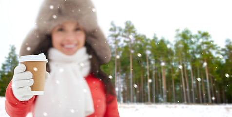 Image showing close up of woman with coffee cup in winter