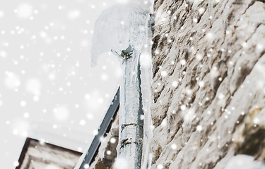 Image showing icicles hanging from building drainpipe