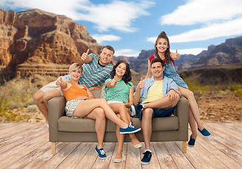 Image showing friends showing thumbs over grand canyon