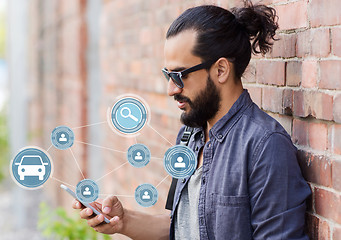 Image showing man using smartphone car sharing app on street