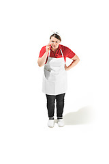 Image showing Portrait of cute serious woman with mobile phone in her hands in the studio, isolated on white background