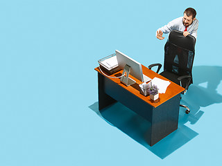 Image showing Shot from above of a stylish business man working on a laptop.