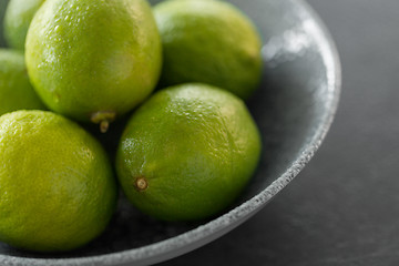 Image showing close up of whole limes in bowl