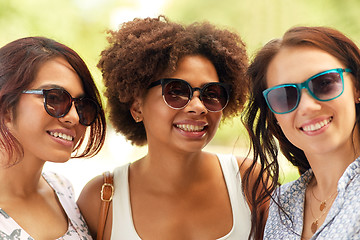 Image showing happy young women in sunglasses outdoors