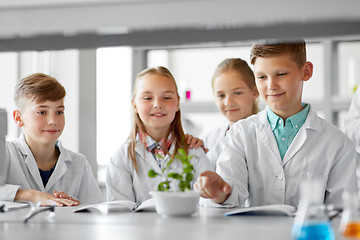 Image showing kids or students with plant at biology class