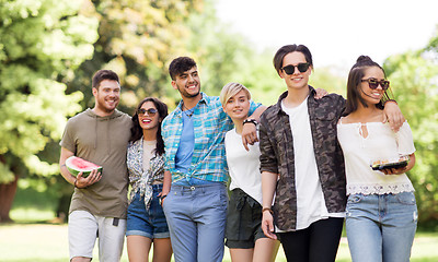 Image showing friends with watermelon and snack at summer park