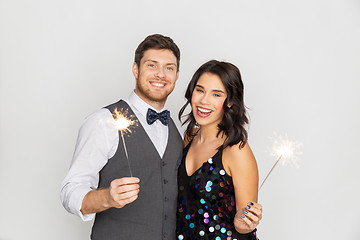 Image showing happy couple with sparklers at party