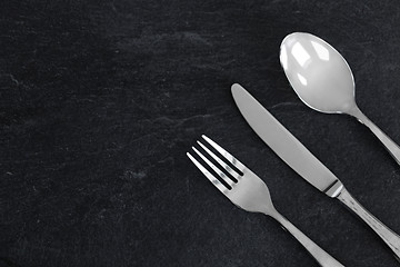 Image showing close up of fork, knife and spoon on table