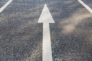 Image showing close up of arrow road surface marking on asphalt