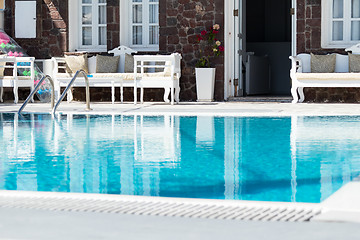 Image showing private pool and sun loungers in the sun