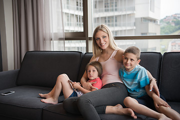 Image showing young mother spending time with kids