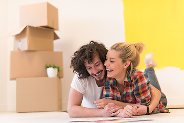 Image showing Happy young couple relaxing after painting