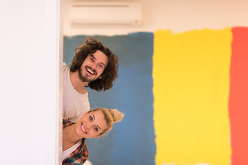 Image showing portrait of a couple painting interior wall